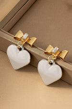 Two tone puffy heart and bow drop earrings.