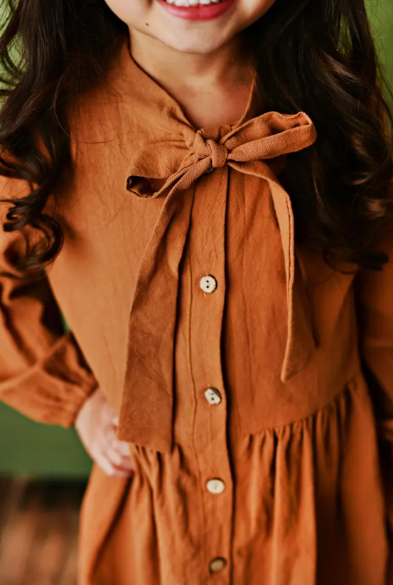 Kids Sienna Colored Button Long Sleeve Bow Dress.